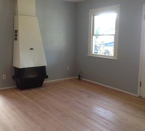 Living room showing light/ceiling fan and original sash cord windows