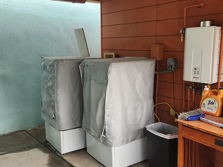 Outside patio laundry with LG washer and LG dryer.