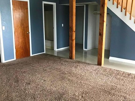 LIVING ROOM LOOKING TO BATHROOM AND BACK BEDROOM