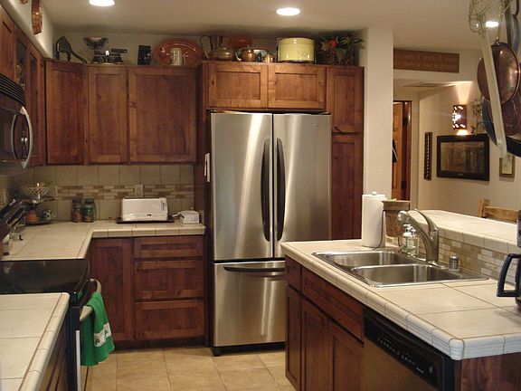 Beautiful kitchen with custom cabinetry and stainless steel appliances.
