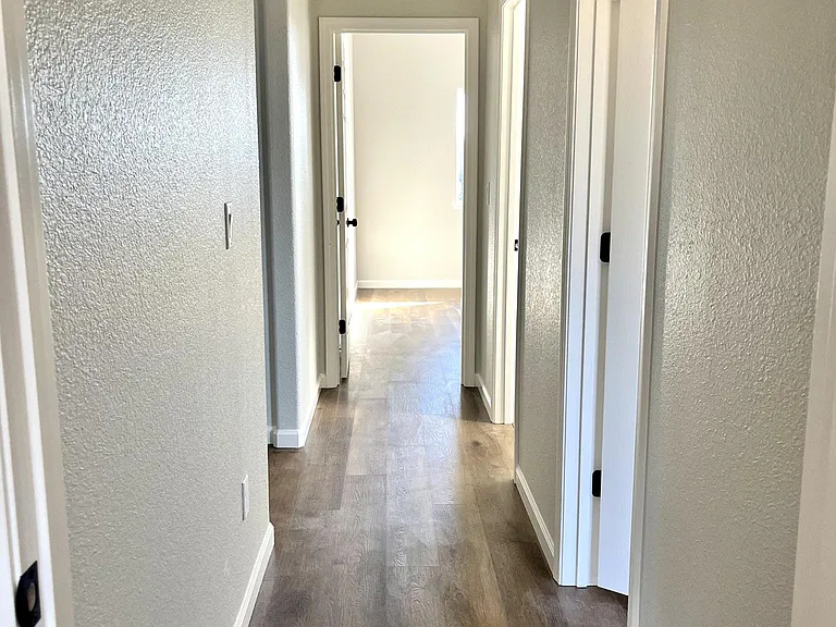 hallway to additional bedrooms