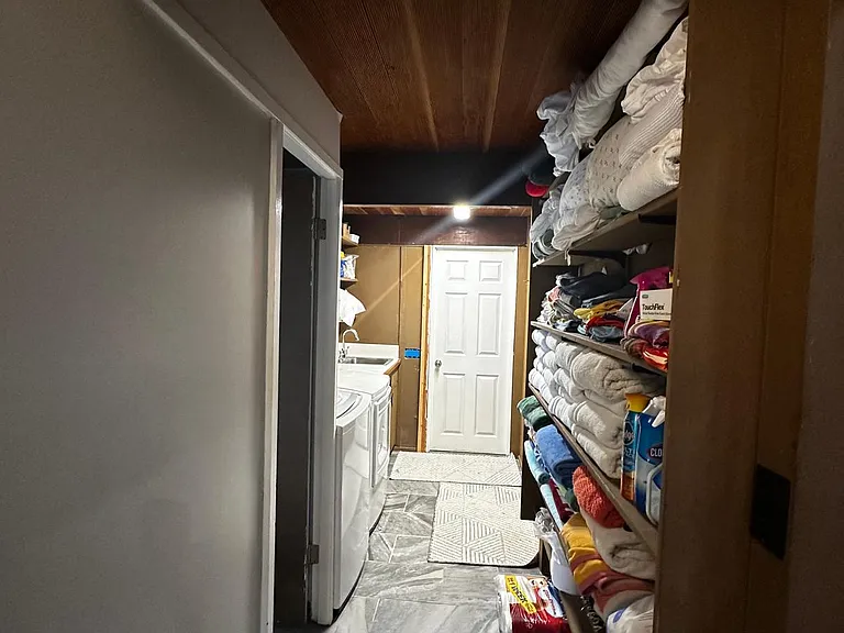 Laundry area and door down into mother-in-law suite