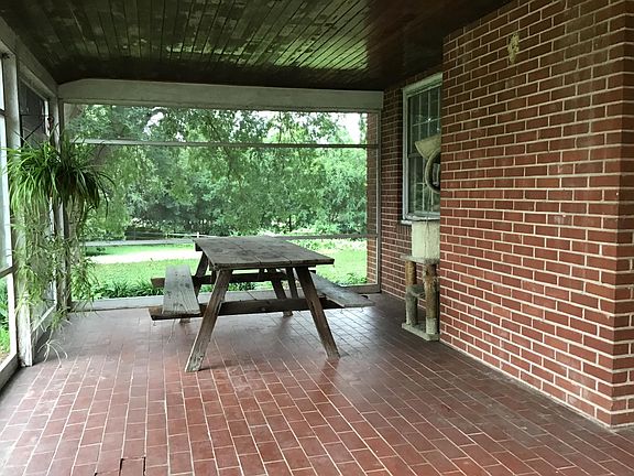 Interior of porch and view of front yard