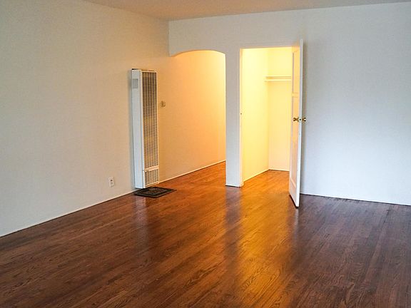 Living Room w/Walk-In Closet and Hardwood Floors