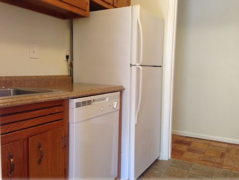 Refinished cabinets, updated countertops, newer dishwasher a