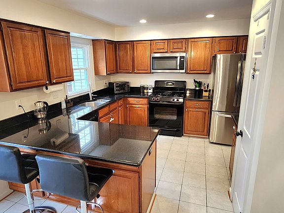 Open kitchen with plenty of cabinet space AND pantry