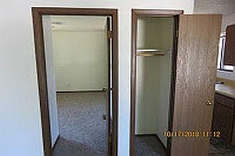 Entry closet and entry door to bedroom