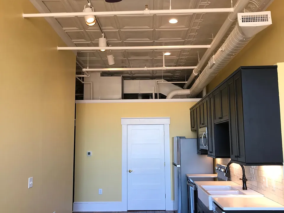 Heart pine floors, ceiling fans, track and recessed can lights (2700K). Press tin ceilings, state of the art HVAC. Insulated for sound and energy efficiency. (Shown-Finished one bedroom/bath kitchen)