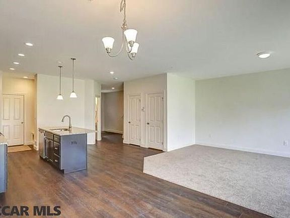 Home under construction. Completed home pictured.