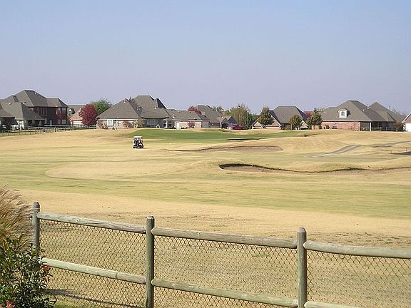 Back yard view of Battle Creek #5 Fairway
