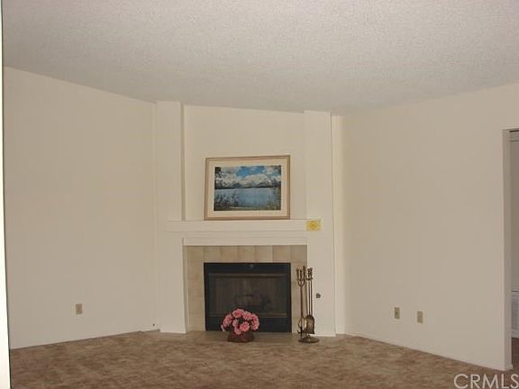 LIVING ROOM HAS PLENTY OF FURNITURE LAYOUT OPTIONS.TV over Fireplace or ON Right Wall. Plenty Of Outlets.