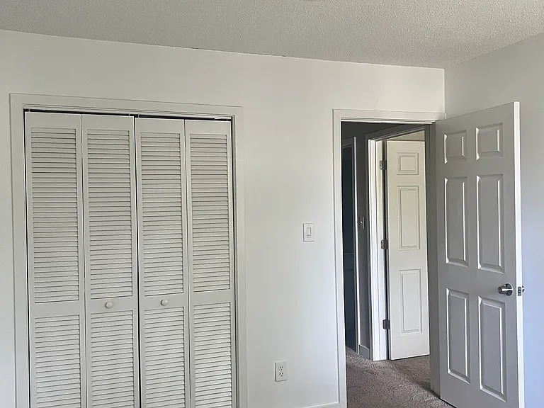 Smaller bedroom closet.