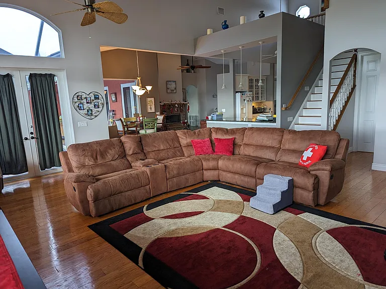 Living room, view from far corner back toward kitchen/dining nook and grand entry.