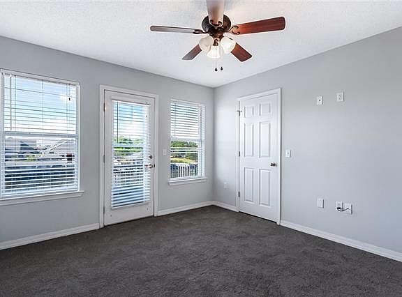 Master bedroom with Balcony overlooking boatdock and waterway.