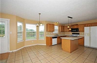 Kitchen. New tile flooring, all appliances stay, updated fixtures, large pantry. Enjoy cooking in th