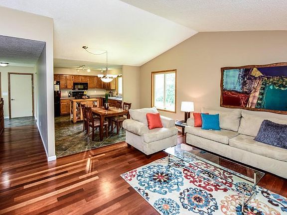Main level living room off the eat in kitchen.