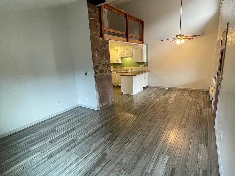 View of living area to kitchen/dining.
