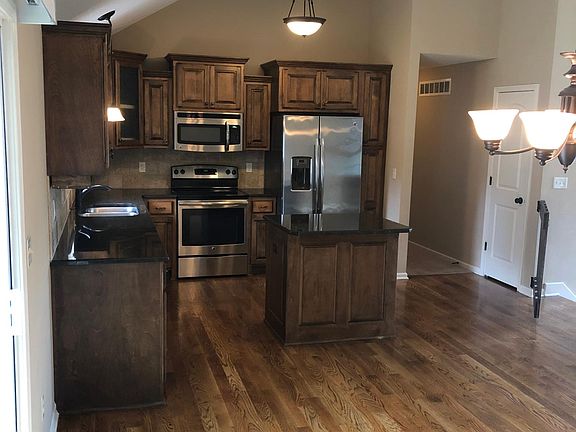 Kitchen with stainless steel appliances and refrigerator included