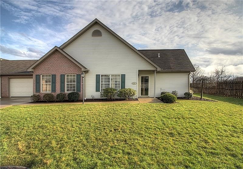 Welcome to 1091 Timberwood Drive, Chippewa Township.   This end unit offers a little more privacy on the patio (right side unsho