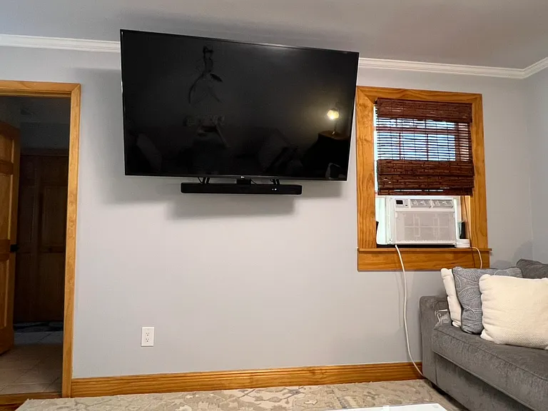 65 in. LG Smart TV with Sony sound bar. Included in rent. Wifi too! Window air unit for those extra hot days (central air also).