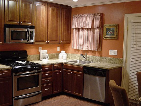 kitchen -with new cherry cabinetry, granite counter tops, stainless steel appl