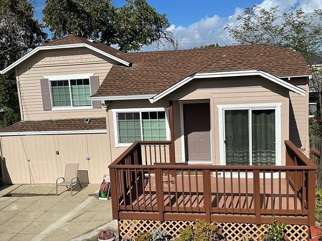 Front of unit with deck. Right garage space for storage