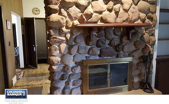 Stone fireplace in Family Rm.