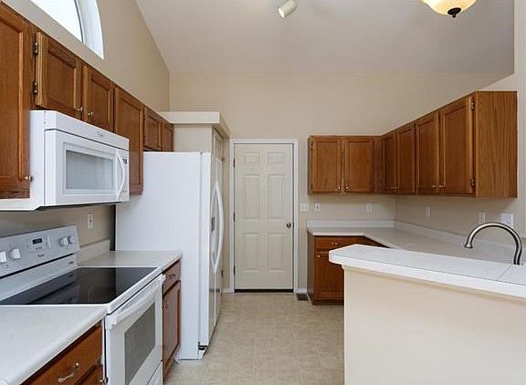 Oak kitchen, Most appliances are about a year old.  Door leads to garage.