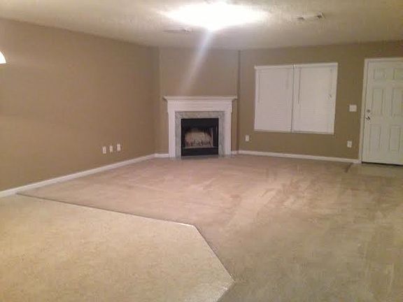 Open floorplan with woodburning fireplace