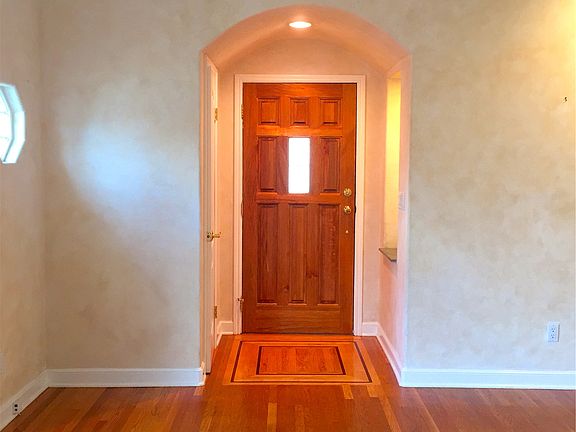 Entry door and gleaming hardwood floor