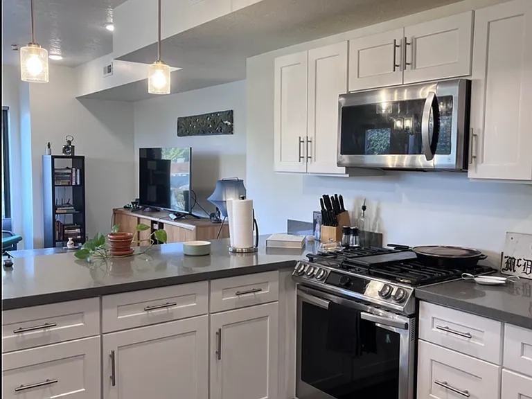 Kitchen with bar top and new appliances