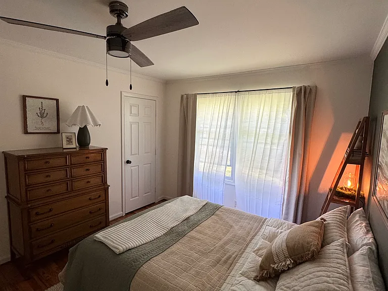 Second Bedroom - queen size bed, dresser, room darkening curtains, shelving