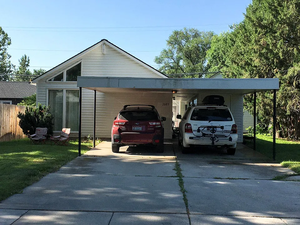 Street view. Covered parking for two cars