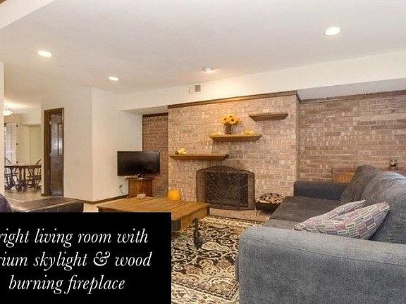 Living Room with Wood/Gas Burning Fireplace