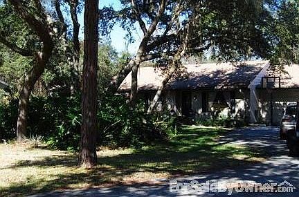 Beautiful wooded setting : Lots of trees and friendly neighbors in neighborhood with custom homes.