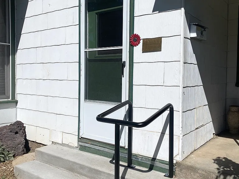 Handrails at both front and back door entrances. Entries have keyless code.
