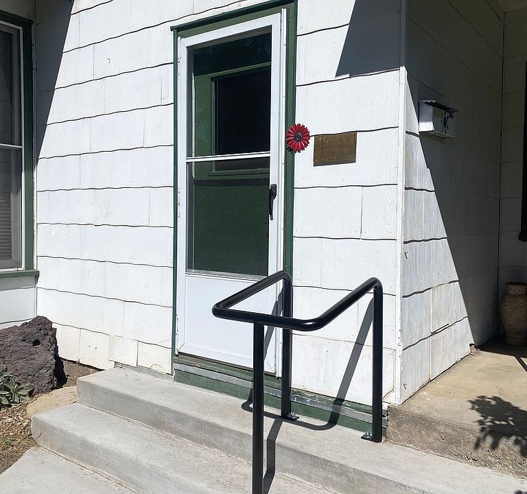 Handrails at both front and back door entrances.