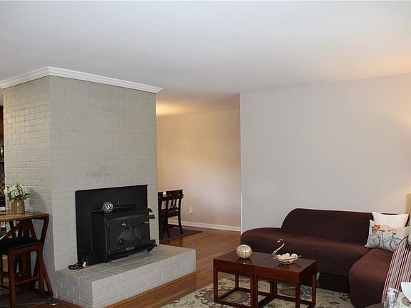 Great open floorplan to include living room with brick fireplace.