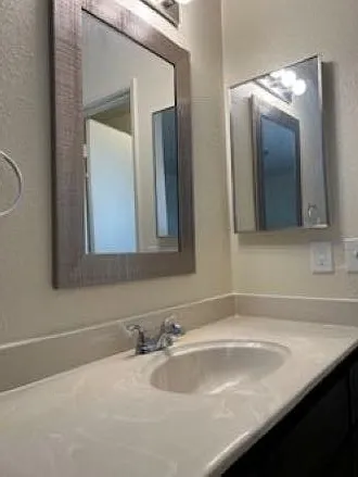 Master bath vanity with designer mirror and medicine cabinet