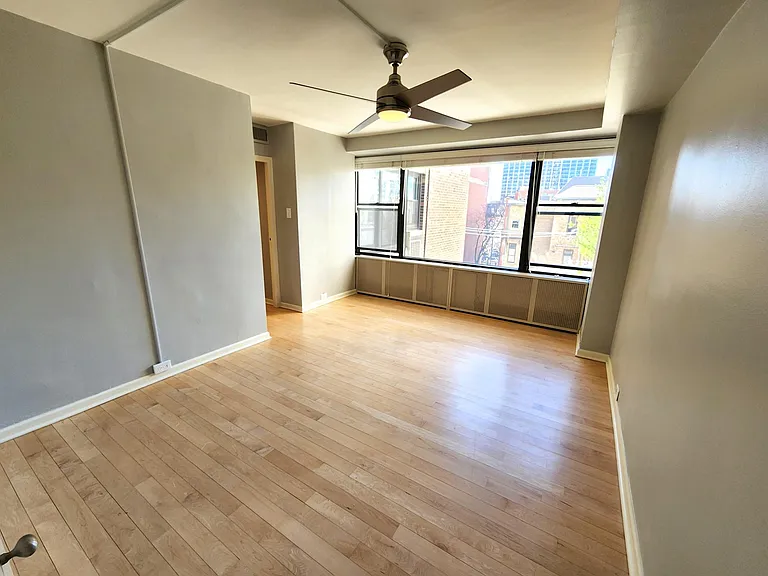 Primary bedroom. The room is 14 ft x 10.5 ft (not including closet and entrance).