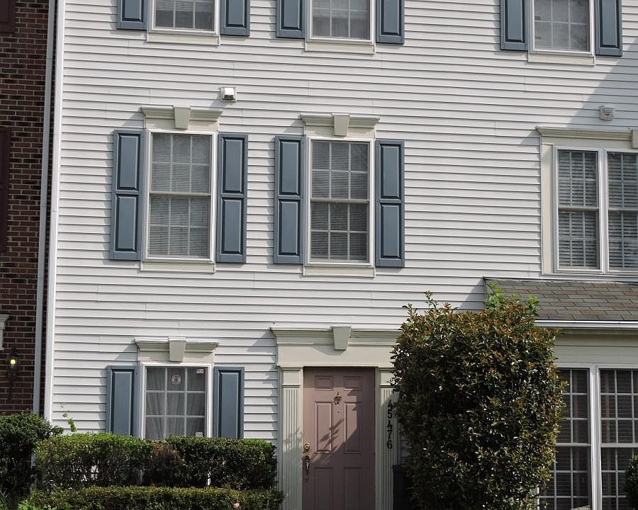 Front of house with private driveway. Reserved spot #228 comes with home.