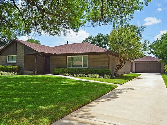 New concrete driveway leads to detached 2 car garage!