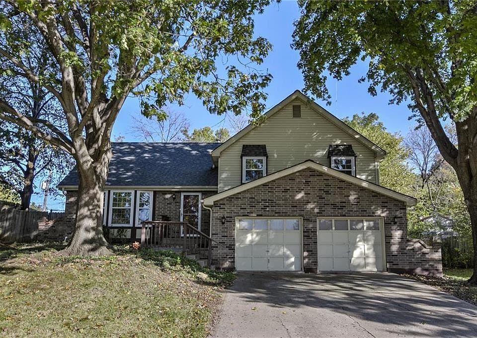 Beautiful home on a quiet tree-lined street. Low Maintenance Brick and Vinyl Siding on exterior of home.