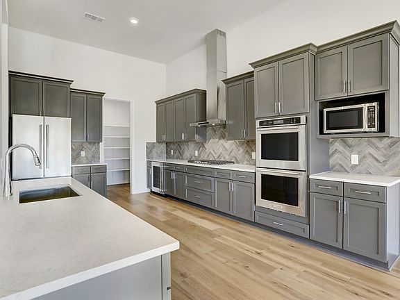 Fall in love with cooking in this designer kitchen with all appliances included.
