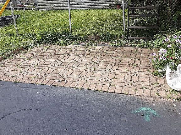 Brick patio end of driveway