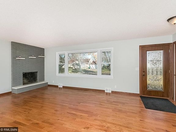 New oak floors and fireplace in living room