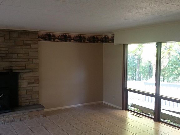 Tiled great room with working wood fireplace