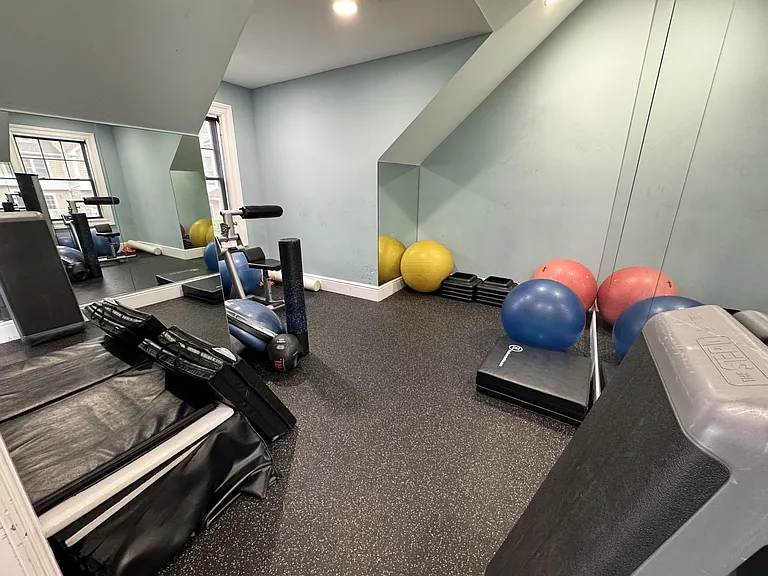 Smaller gym room off larger gym for a more intimate workout. Walls mirrored and plenty of mats and equipment to use.