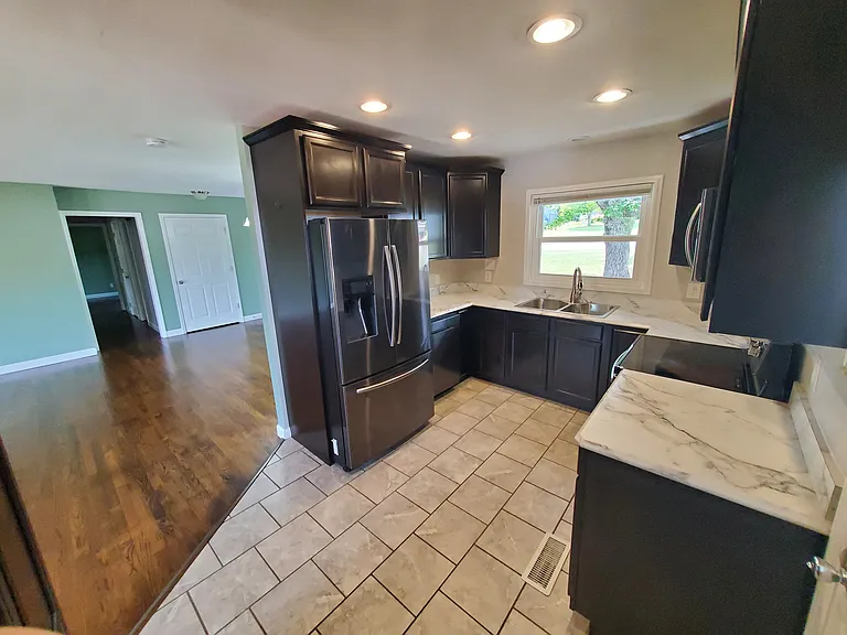 View of kitchen from carport side door.