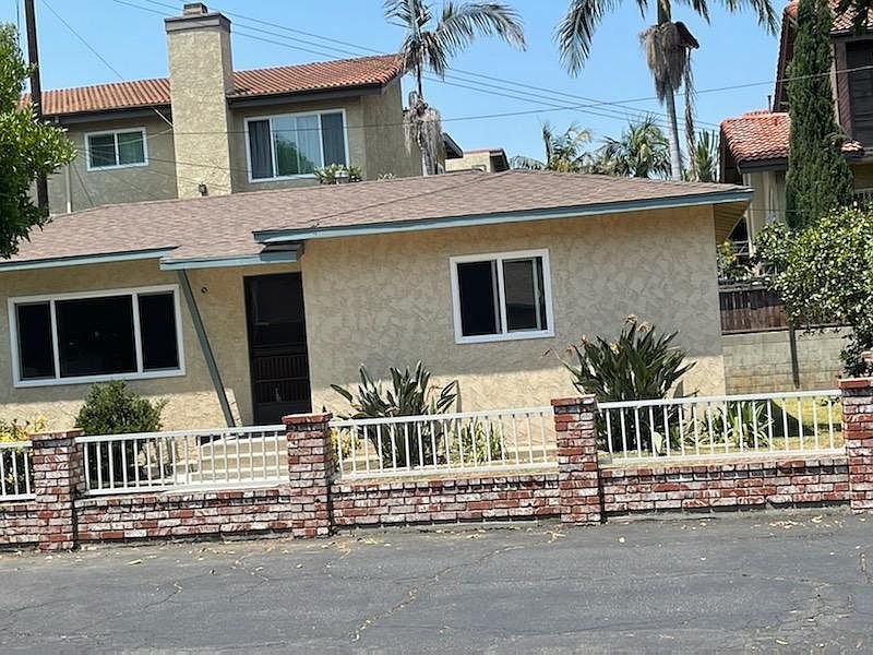 Front view, Rt side is 1 of the bedroom windows and more side yard